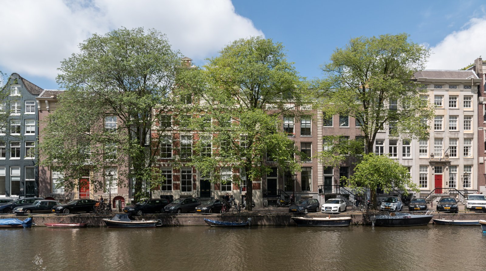 Amsterdam canal with bicycles and traditional canal houses