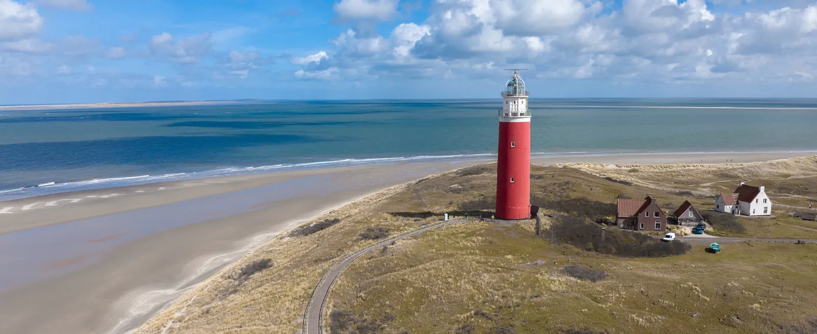 The red lighthouse of Texel on the dunes, a Wadden island north of Amsterdam