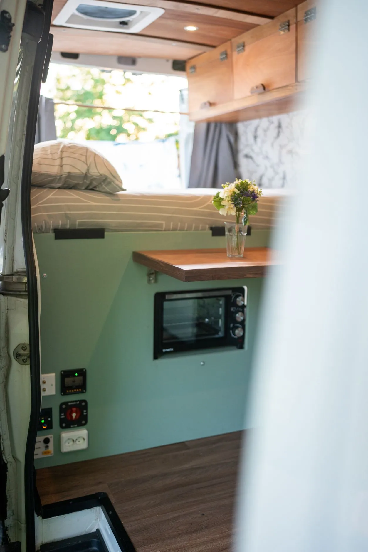 Horizon campervan interior, bed, oven and storage